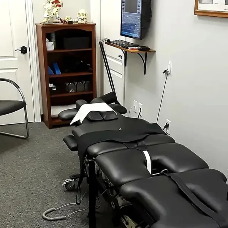 Home 17 chiropractic-exam-room-with-black-adjusting-table-spine-model-california-oaks-chiropractic-image